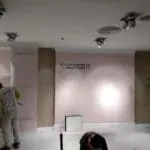 Metallic store signage for Rustan’s client installed in Makati, with workers and tools visible. By M&G Global Ads.