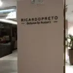 Black acrylic RICARDOPRETO signage for Rustans at retail store with plants and signs, Makati, by M&G Global Ads.