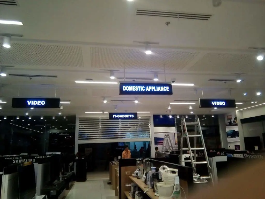 Illuminated indoor signage for appliances and electronics in a Makati retail store, shop interior design by M&G Global Ads.