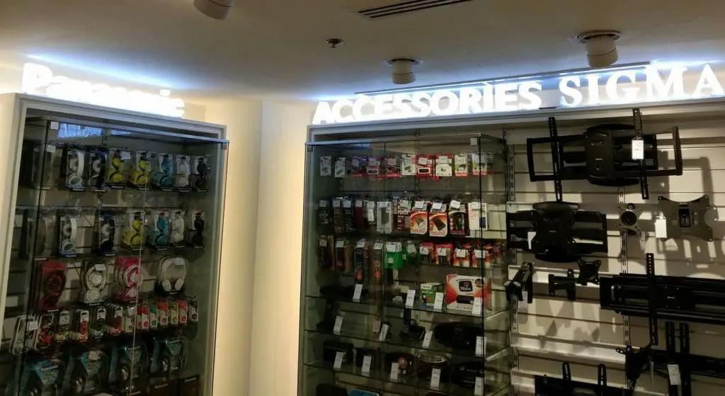 Metallic Panasonic signage for accessories display cases at electronics store in Makati by M&G Global Ads.