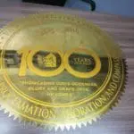 brass engrave anniversary signage for Pasay Adventist Church, wooden table display in Makati, by M&G Global Ads.