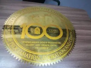 brass engrave anniversary signage for Pasay Adventist Church, wooden table display in Makati, by M&G Global Ads.