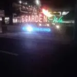 Neon LED signage for Nobleland’s Garden Walk in Makati, with colorful leaf design accents at night, by M&G Global Ads.