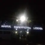 Illuminated acrylic signage for MARIA EXALTACION LODGE on building at night in Quezon City by M&G Global Ads.