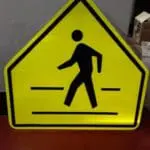 Pedestrian crossing warning signage, yellow reflective metal, seen in Makati, by M&G Global Ads.
