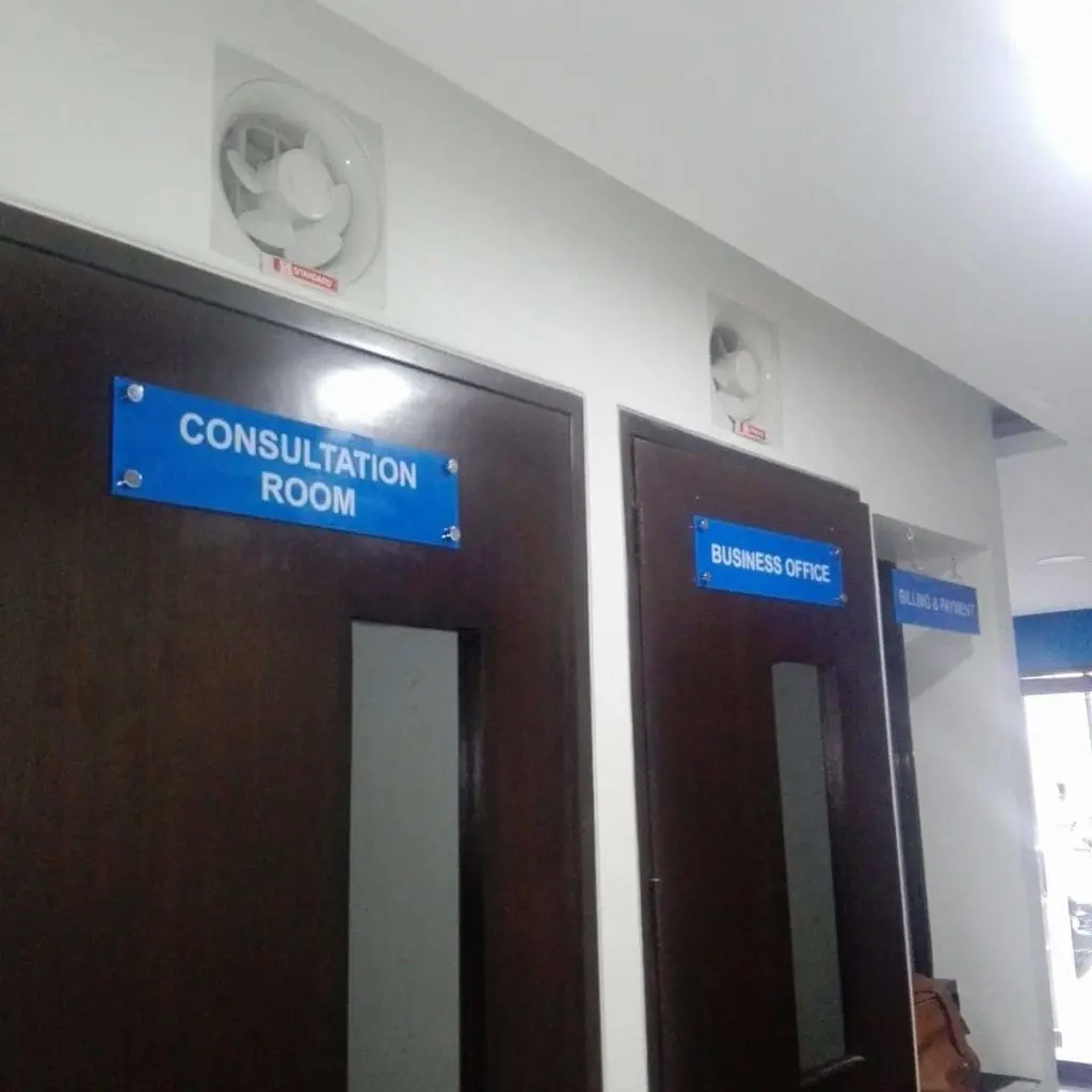 Blue acrylic door signage for Consultation Room, Business Office, Billing & Inquiry in Makati hallway by M&G Global Ads.