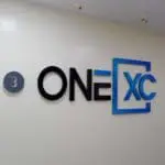 Outdoor pylon signage with number 3 in gray circle, ONE XC logo, blue frame; Ortigas location by M&G Global Ads.