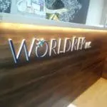 Metallic indoor reception signage for WORLDREP INC. with airplane icon, Makati office lobby by M&G Global Ads.