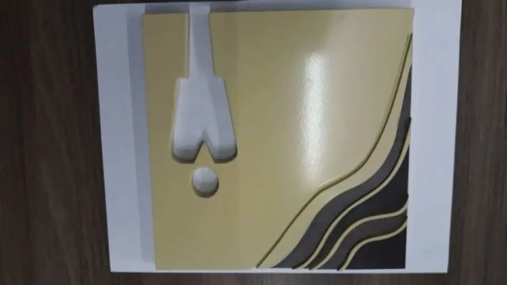 Modern indoor signage with raised abstract shapes and arrows on beige and black, Ortigas location, by M&G Global Ads.