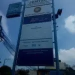 Pylon signage for JEMTEE Holding Corporation, UCPB, and Emerson in Makati with urban backdrop by M&G Global Ads.
