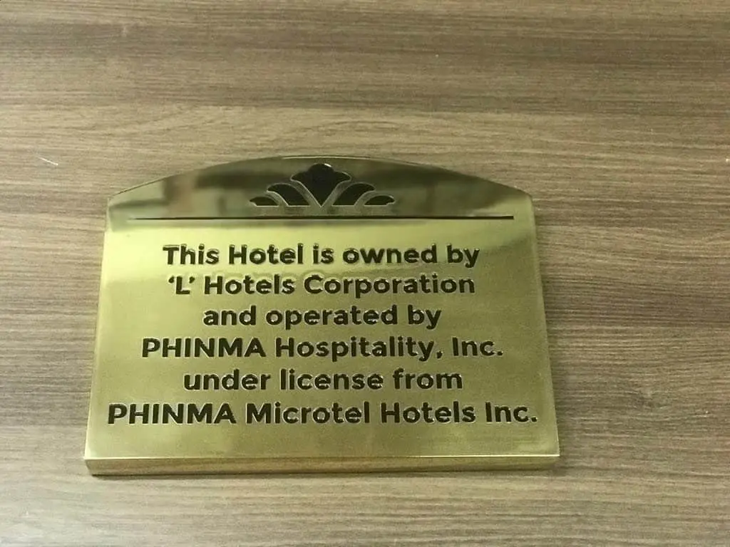 Gold hotel lobby signage plaque for L Hotels Corporation, PHINMA Hospitality in Makati by M&G Global Ads.