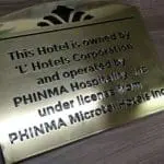 Metal hotel sign for PHINMA Hospitality, Inc. on wood in Makati, by M&G Global Ads.