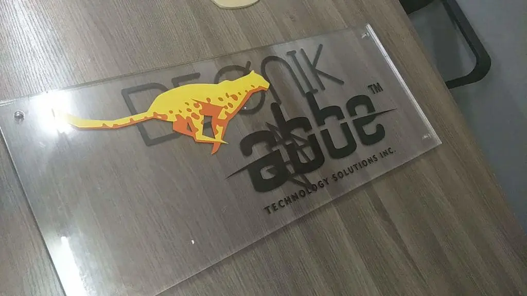 Acrylic logo signage for DESIGN abbe TECHNOLOGY SOLUTIONS INC., displayed in Ortigas, by M&G Global Ads.