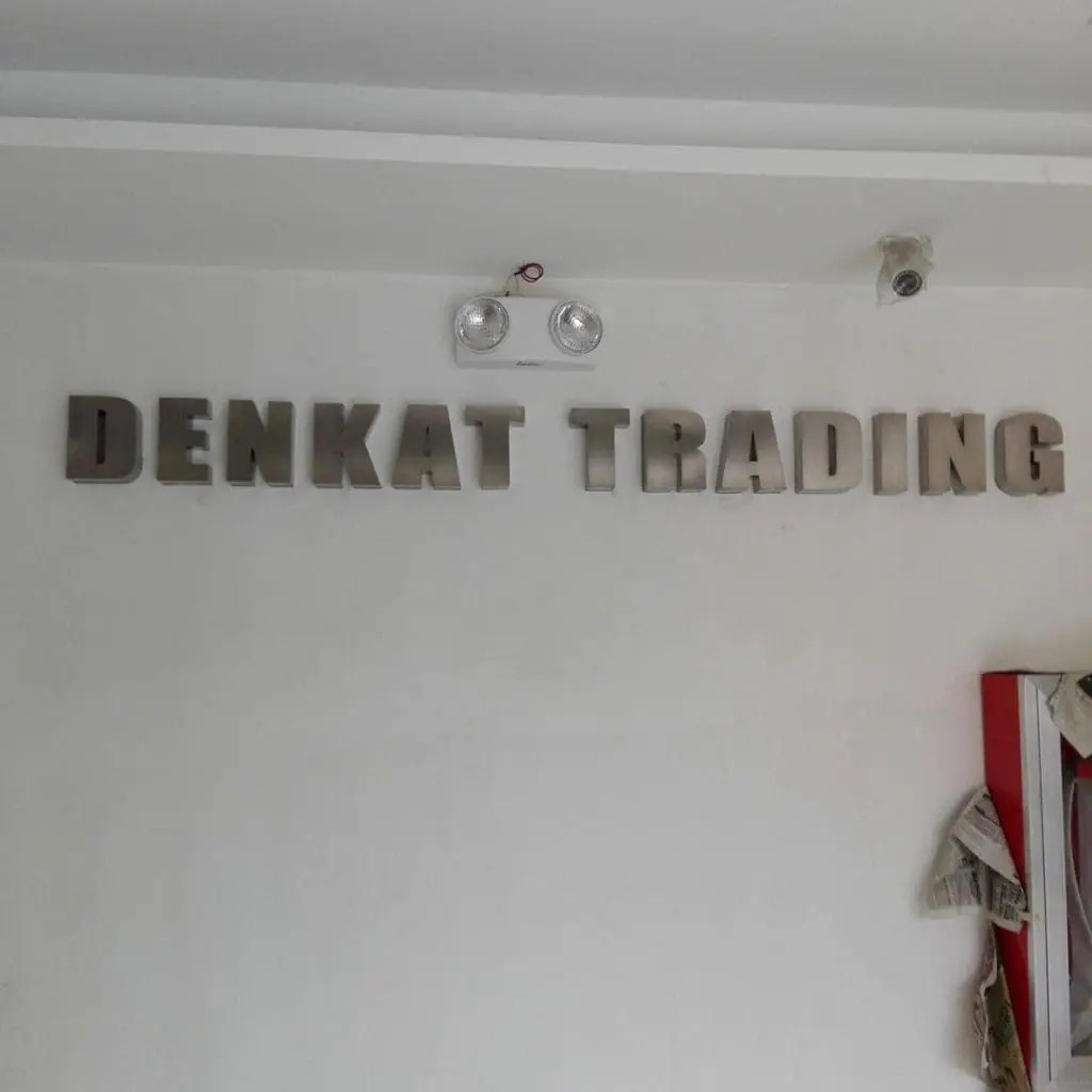 DENKAT TRADING metallic indoor signage installation in Makati, with emergency light and security camera, by M&G Global Ads.