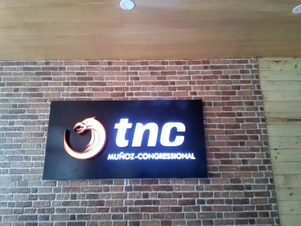 Outdoor rectangular signage for tnc MUÑOZ-CONGRESSIONAL in Quezon City with orange dragon logo by M&G Global Ads.
