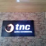 Outdoor rectangular signage for tnc MUÑOZ-CONGRESSIONAL in Quezon City with orange dragon logo by M&G Global Ads.