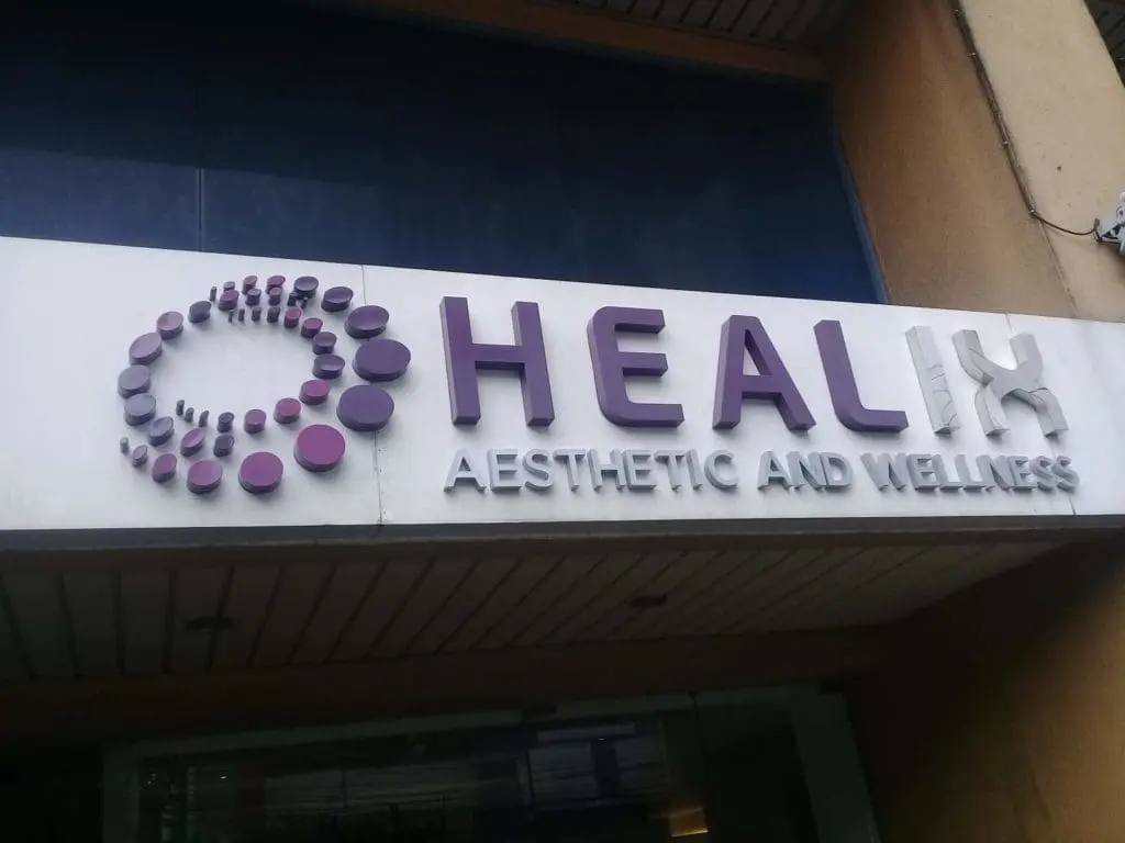 Acrylic 3D signage for HEALIX Aesthetic and Wellness in Makati, with purple-gray letters and dot detail, by M&G Global Ads.