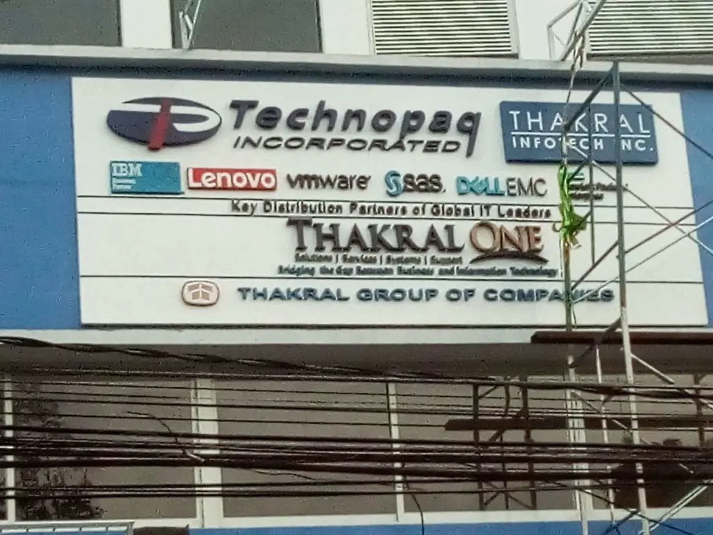 LED signage for Technopaq, Thakral Group, IBM, Lenovo & more in Makati by M&G Global Ads; building facade with power lines.