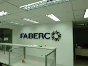 FABERCO metallic logo sign with LED signage in a modern office in BGC, Metro Manila, by M&G Global Ads.