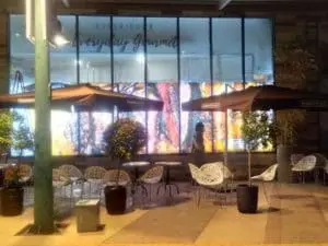 Restaurant outdoor signage for Experience Everyday Gourmet, large window display in BGC at night by M&G Global Ads.