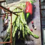 Marketplace large building signage in Quezon City with fresh asparagus, red peppers, and peppercorns by M&G Global Ads.