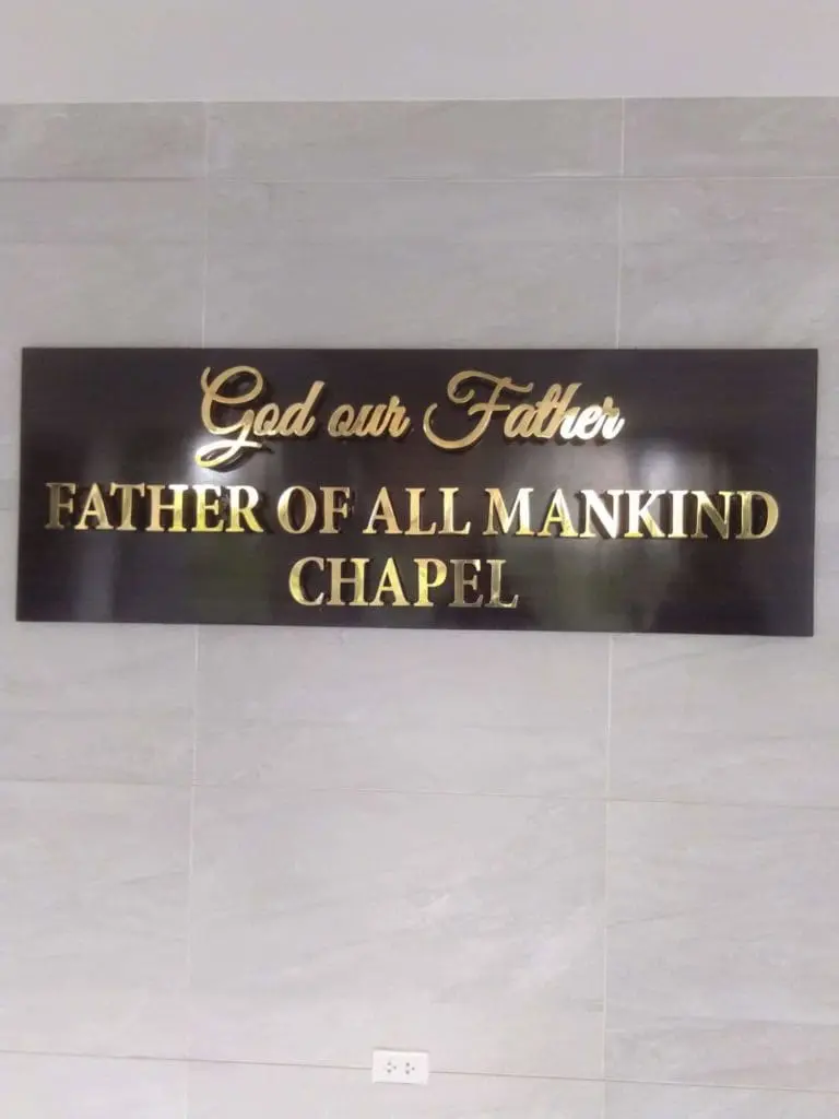 Acrylic wall signage for God our Father FATHER OF ALL MANKIND CHAPEL in Makati on gray tiles by M&G Global Ads.