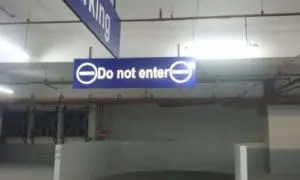 Indoor parking garage signage in Makati reads Do not enter with no entry symbols, guiding drivers by M&G Global Ads.