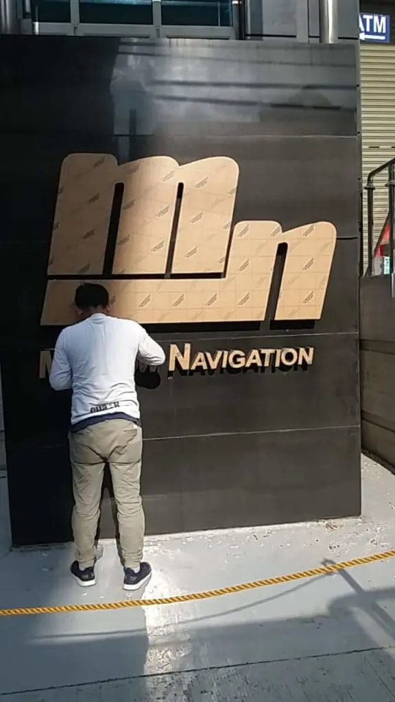Outdoor building signage installation for NAVIGATION, metallic channel letters in Mandaluyong by M&G Global Ads.