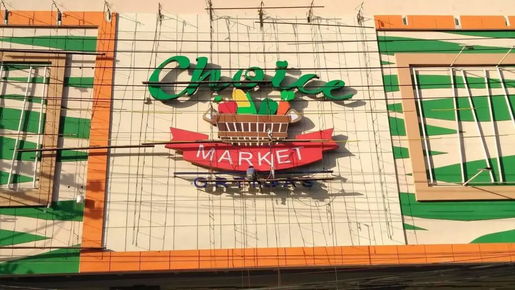 Metal indoor signage for Choice Market with shopping cart graphic, Makati location, by M&G Global Ads.