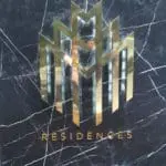 Metallic RESIDENCES signage for development in Makati with gold geometric building shapes, by M&G Global Ads.