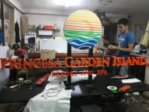 Building signage for Princesa Garden Island Resort and Spa in Makati, with logo and tools visible, by M&G Global Ads.