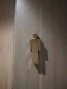 Metallic male restroom building signage on wooden wall with shadow, Mandaluyong, by M&G Global Ads.