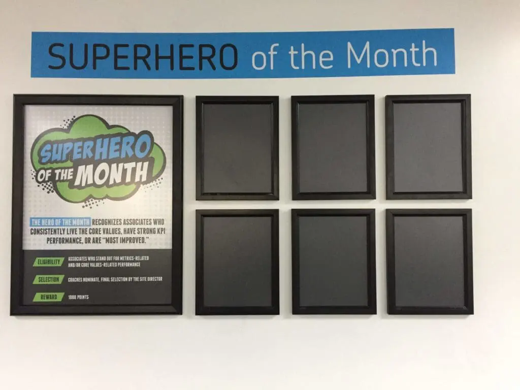 Superhero of the Month building signage display with black frames in Makati office, core values focus by M&G Global Ads.