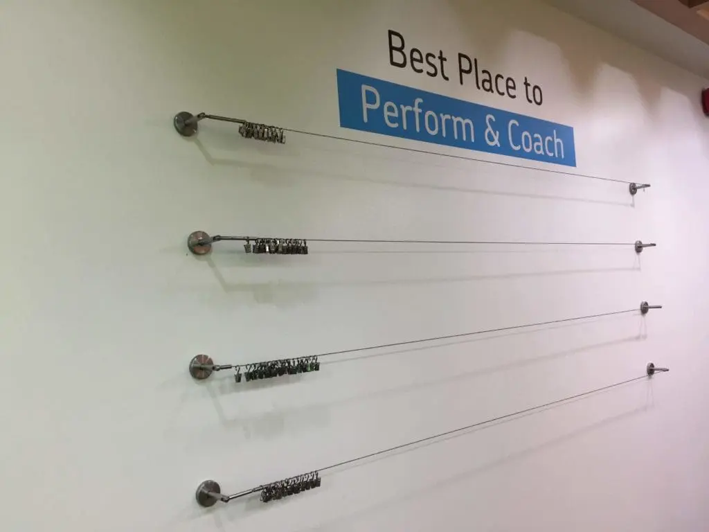 Indoor acrylic office signage for Best Place to Perform & Coach, with metal wires, in Makati by M&G Global Ads.