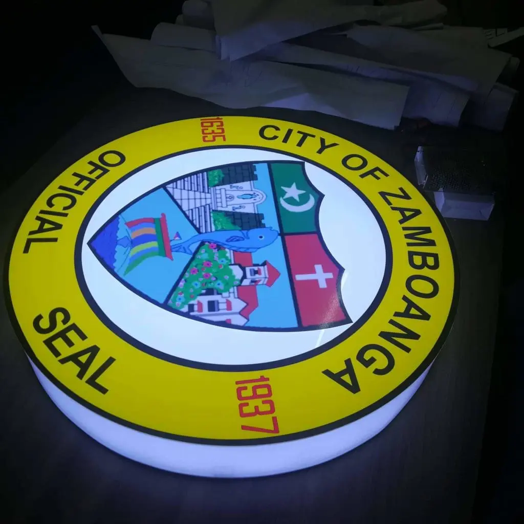 Illuminated metallic round signage for City of Zamboanga seal, Quezon City installation by M&G Global Ads.