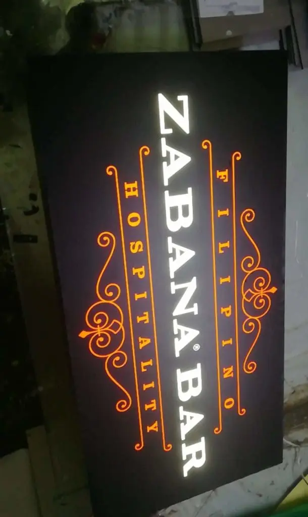 Metallic bar signage for Zabana Bar with orange accents, spotted in BGC, by M&G Global Ads.