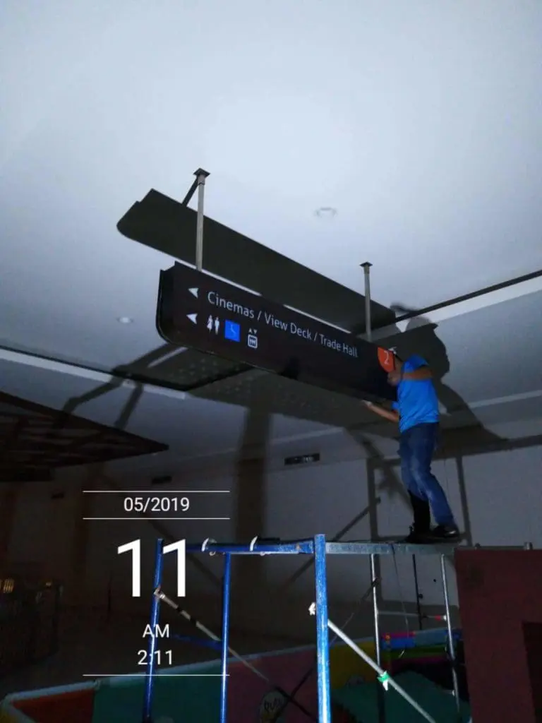 Indoor directional signage installation at a cinema in Mandaluyong, May 2019, by M&G Global Ads.
