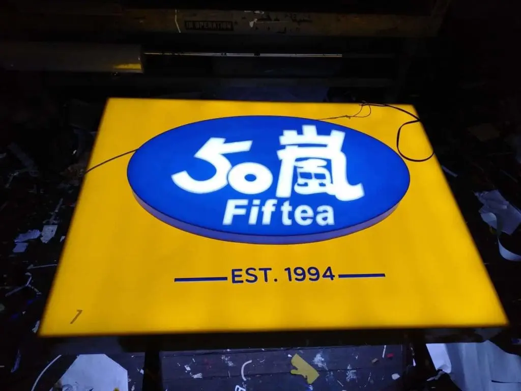 LED signage for Fiftea with blue oval, Chinese characters, EST. 1994 in Cubao. Outdoor sign by M&G Global Ads.