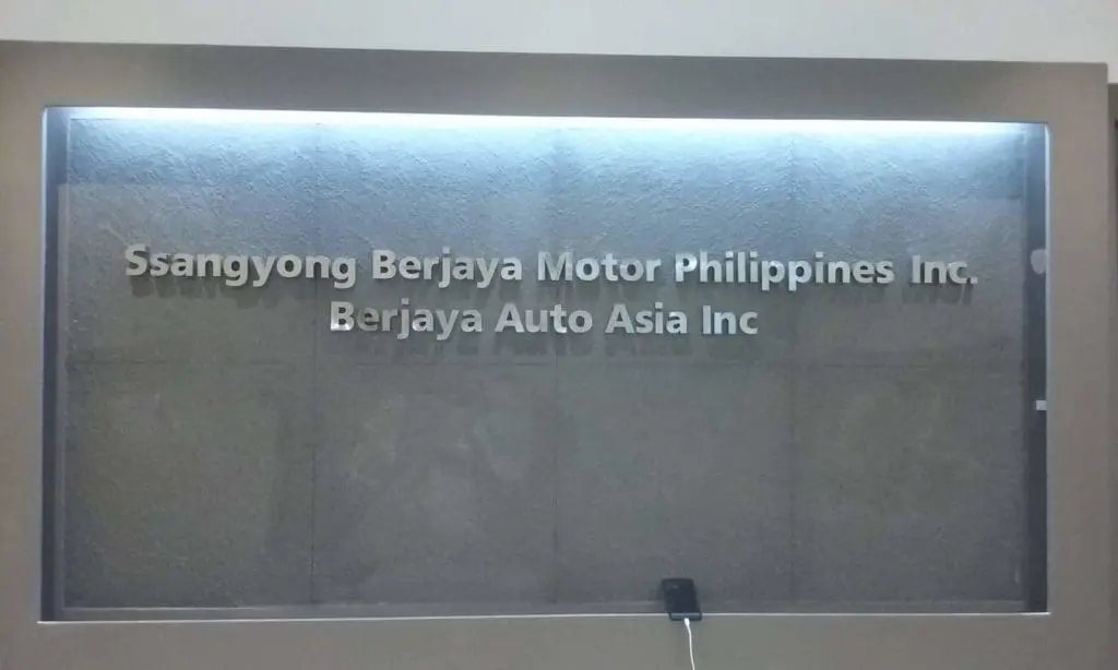 Stainless indoor corporate sign for Ssangyong Berjaya Motor Philippines, Ortigas, with security device by M&G Global Ads.