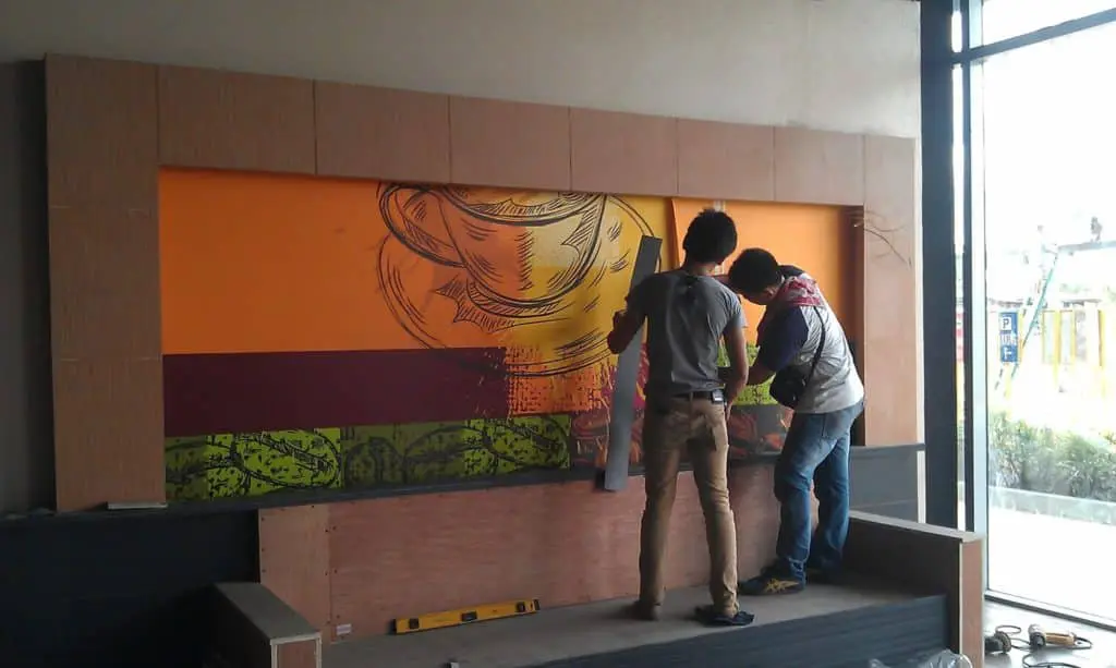 Cafe wall mural signage installation with coffee cup design in Mandaluyong by M&G Global Ads.