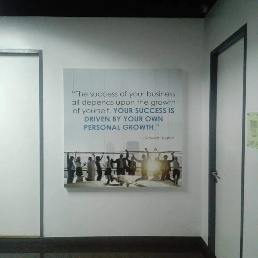Framed acrylic signage for corporate client in BGC with motivational quote and silhouettes by M&G Global Ads.