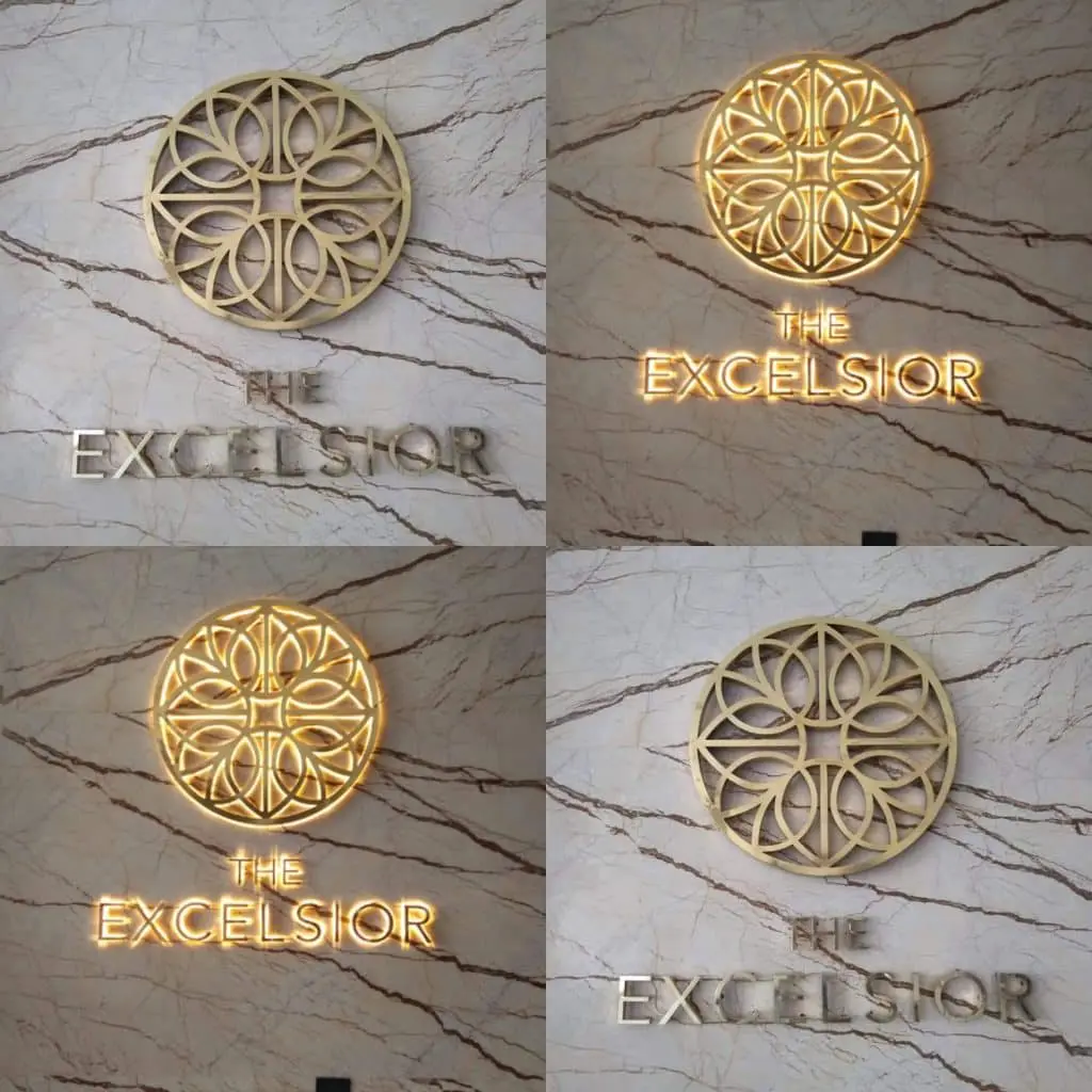 Hotel lobby metal signage for The Excelsior in Makati with gold geometric design and lighting effects, by M&G Global Ads.