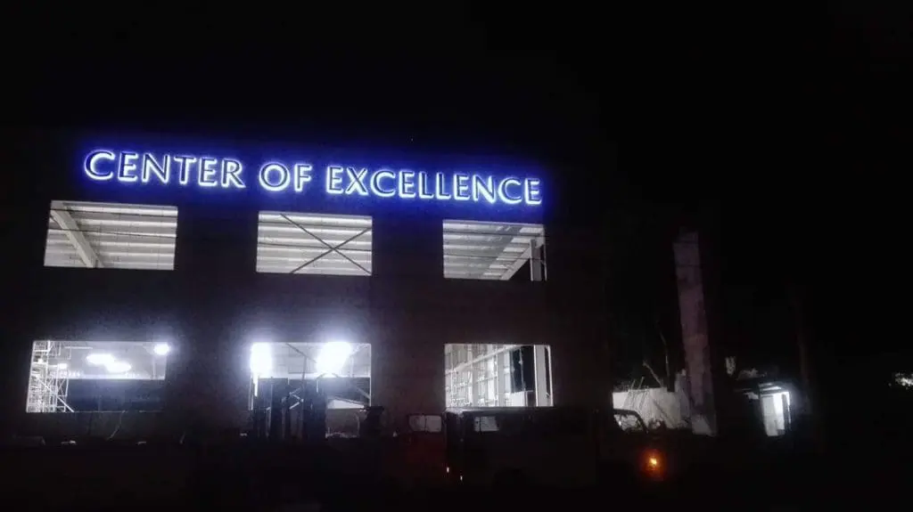 Illuminated LED signage CENTER OF EXCELLENCE at night, building in Ortigas, by M&G Global Ads.