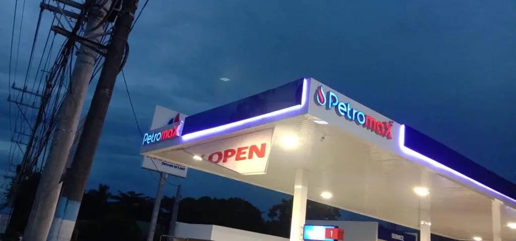Illuminated acrylic signage at Petromax gas station in Ortigas with red OPEN sign at dusk by M&G Global Ads.