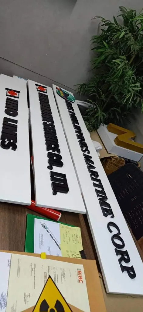 Metallic 3D nameplates signage for PANDIMES MARITIME CORP on office desk in BGC by M&G Global Ads.