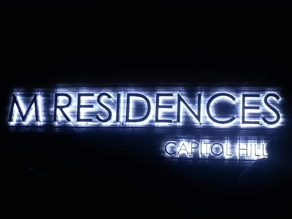 Illuminated outdoor signage for M Residences with neon lights in Capitol Hill, Mandaluyong, by M&G Global Ads.
