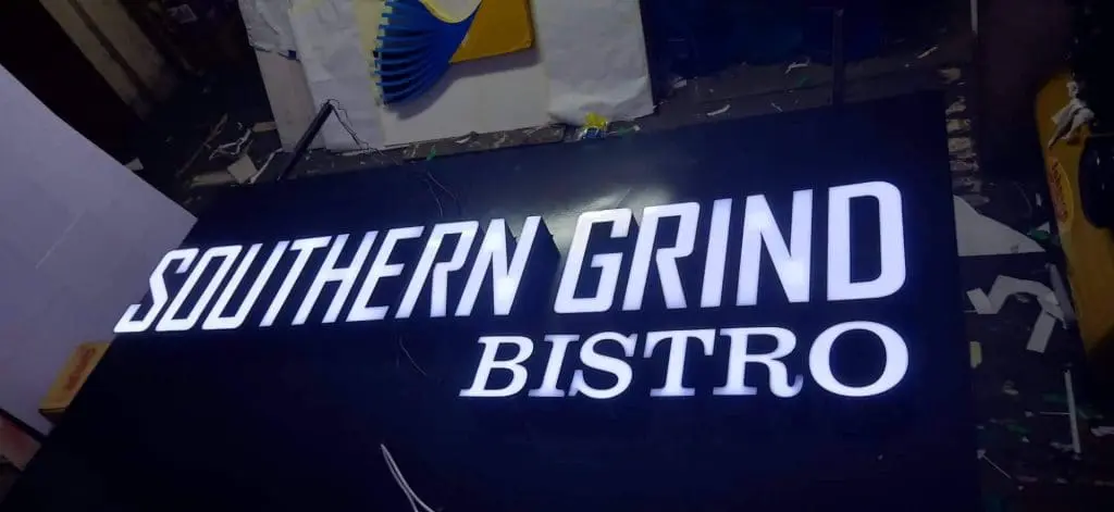 Illuminated indoor bistro signage for SOUTHERN GRIND in bold white letters, Makati location, by M&G Global Ads.