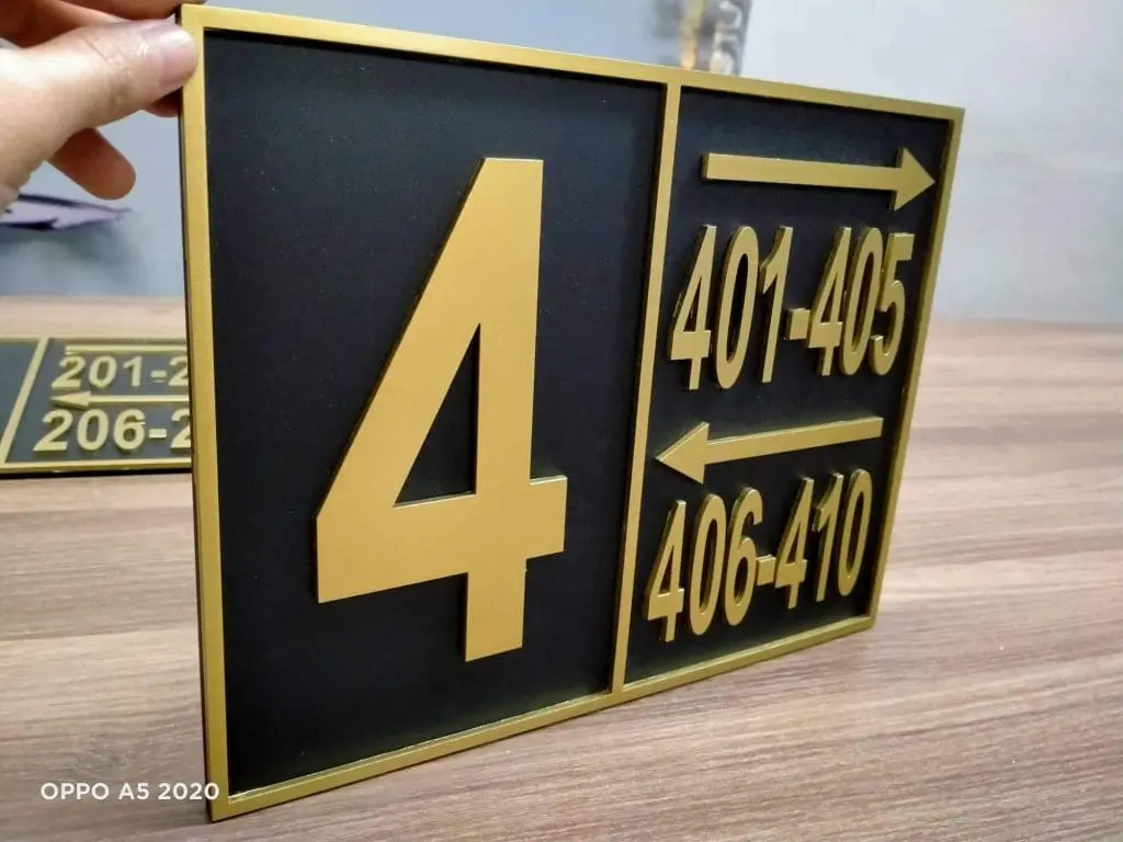Hotel wayfinding signage with gold number 4 and room arrows, black and gold design in Makati by M&G Global Ads.