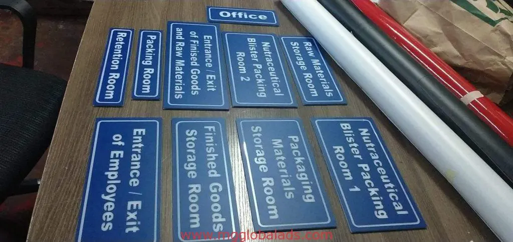 LED office room and storage signage for business in Makati on table, blue and white metal signs by M&G Global Ads.