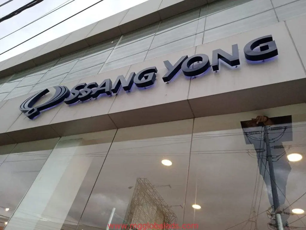 SSANGYONG metallic building signage at a glass-fronted showroom in Ortigas, Metro Manila, by M&G Global Ads.